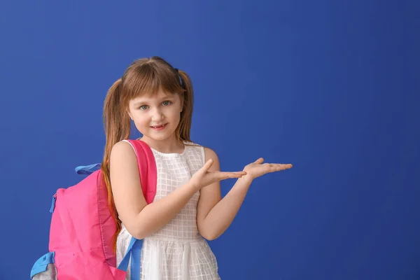 Cute Little Schoolgirl Showing Something Color Background — Stock Photo, Image