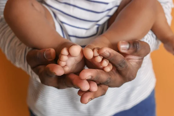 Happy African American Man Cute Baby Color Background Closeup — Stock Photo, Image