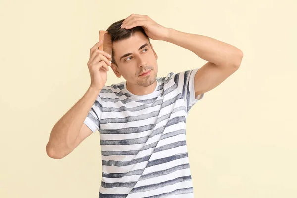 Handsome Young Man Combing Hair Color Background — Stock Photo, Image