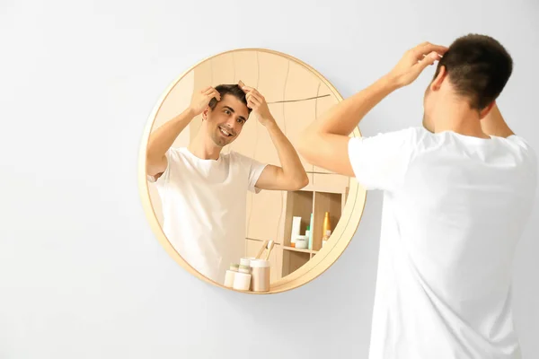 Handsome Young Man Combing Hair Home — Stock Photo, Image