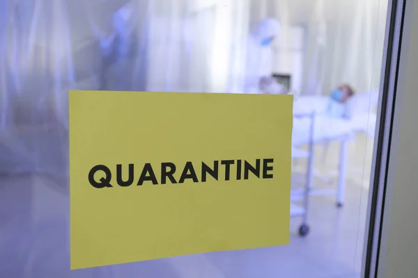 Paper sheet with text QUARANTINE on door of contagious isolation ward