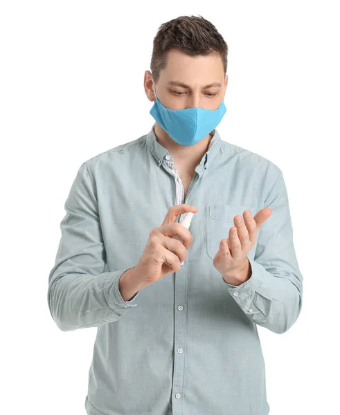 Man Met Beschermend Medisch Masker Met Ontsmettingsmiddel Witte Achtergrond — Stockfoto