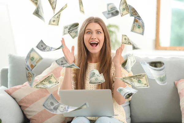 Surprised Young Woman Laptop Flying Money Home — Stock Photo, Image