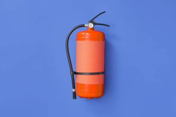 Fire extinguisher on color background