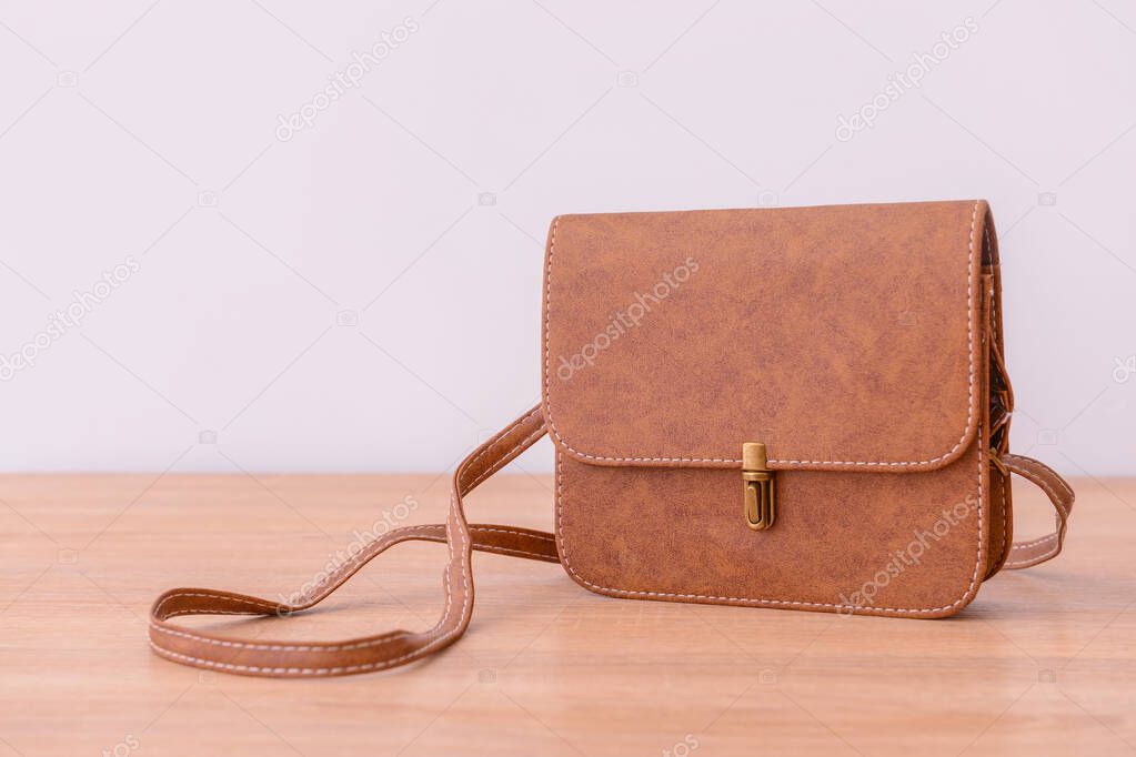 Stylish bag on wooden table