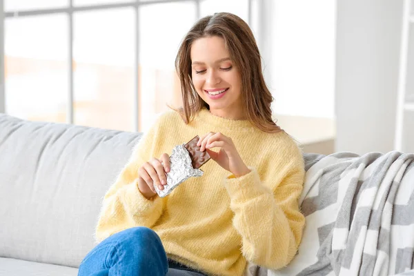 Beautiful Young Woman Eating Chocolate Home — Stock Photo, Image