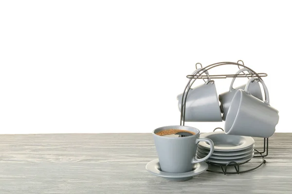 Suporte Com Copos Pires Mesa Contra Fundo Branco — Fotografia de Stock