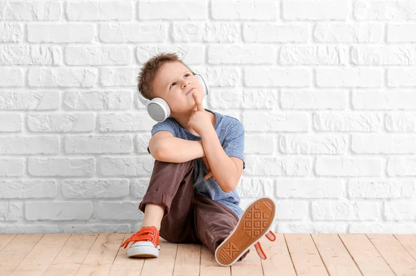 Cute Little Boy Listening Music White Brick Wall — Stock Photo, Image