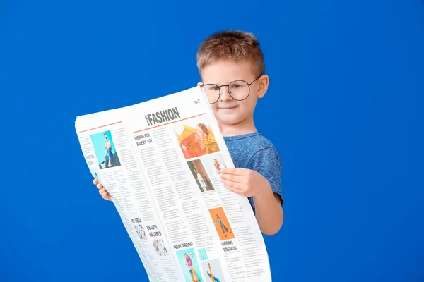 Lindo Niño Leyendo Periódico Sobre Fondo Color —  Fotos de Stock