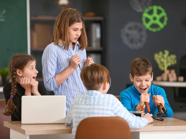 Pupils at physics lesson in classroom