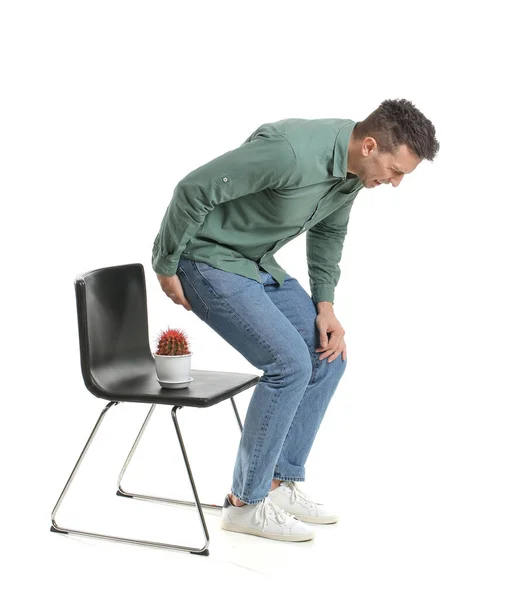 Young Man Chair Cactus White Background Hemorrhoids Concept — Stock Photo, Image