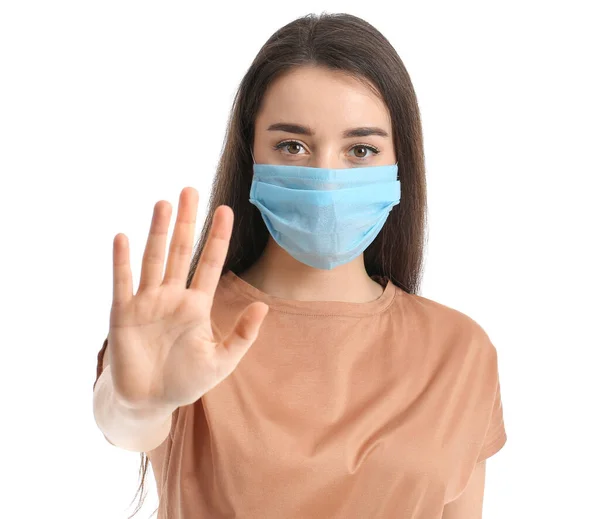 Mujer Joven Con Máscara Médica Mostrando Gesto Stop Contra Fondo —  Fotos de Stock