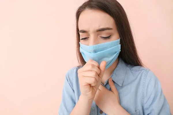 Ill Young Woman Wearing Medical Mask Color Background — Stock Photo, Image