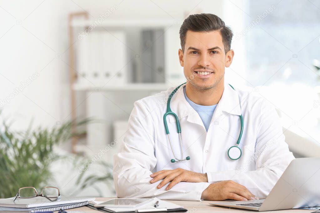 Young male doctor working in clinic