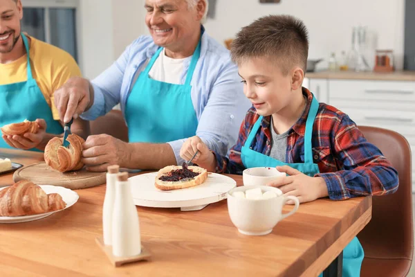 Man His Father Son Eating Croissants Home — Stock Photo, Image