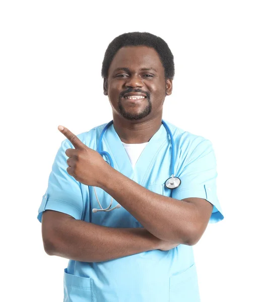 Male African American Doctor Pointing Something White Background — Stock Photo, Image