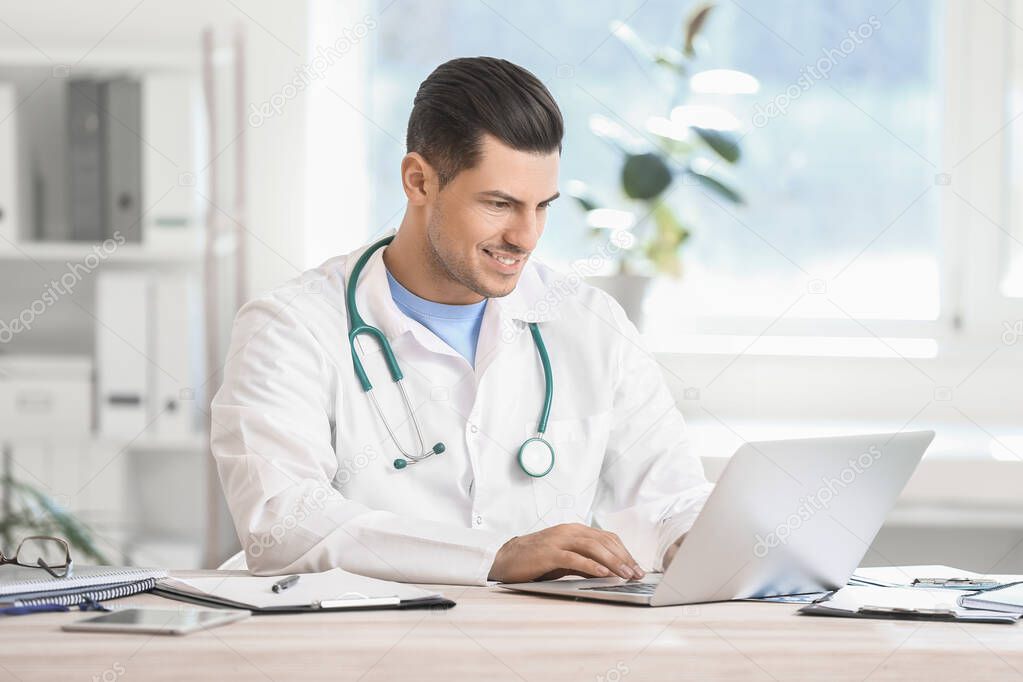 Young male doctor working in clinic