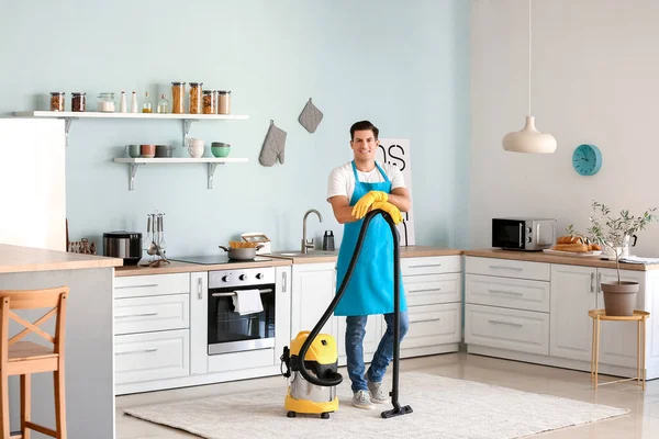 Young Man Vacuum Cleaner Kitchen — Stock Photo, Image