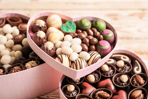 Heart Shaped Boxes Delicious Candies Wooden Background — Stock Photo, Image