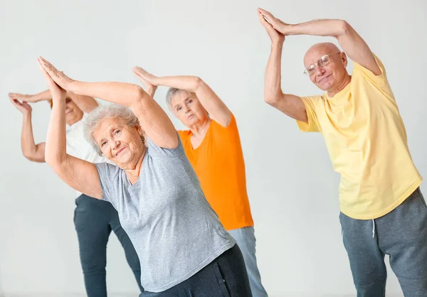 Elderly People Exercising Gym — Stockfoto