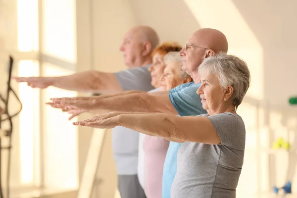 Elderly People Exercising Gym — Stockfoto