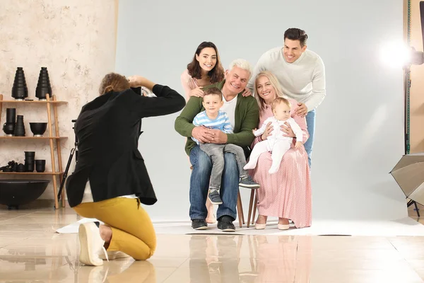 Photographer working with family in studio