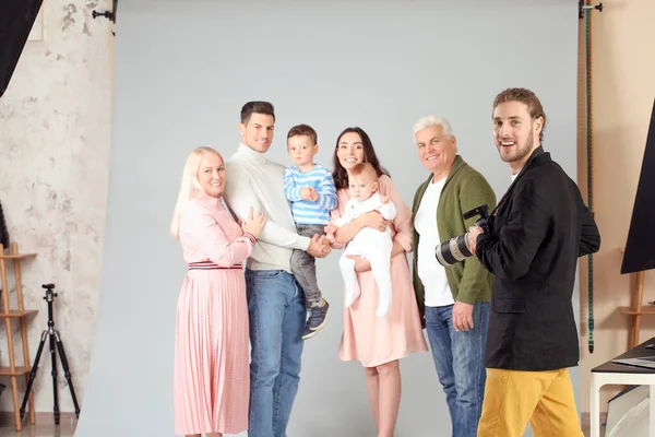 Photographer working with family in studio