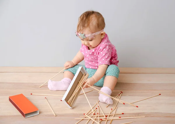 Little Baby Playing Matches While Sitting Table Child Danger — Stock Photo, Image