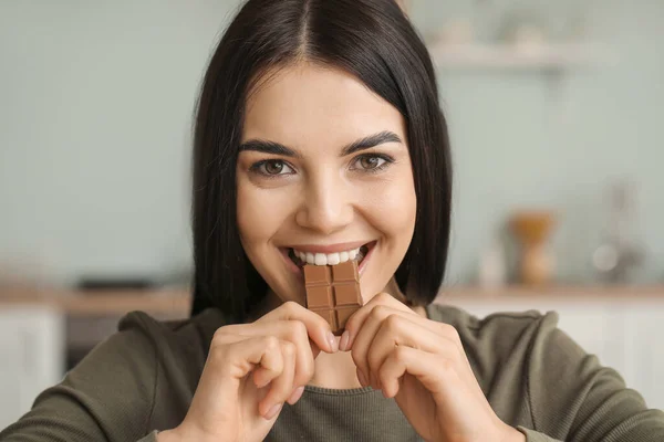 Beautiful Young Woman Eating Chocolate Kitchen — Stock Photo, Image