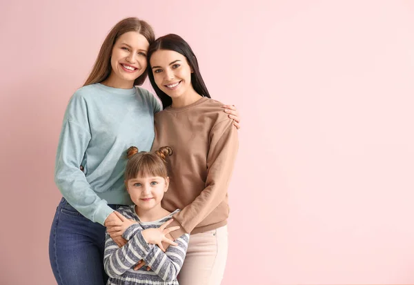 Happy Lesbian Couple Little Adopted Girl Color Background — Stock Photo, Image