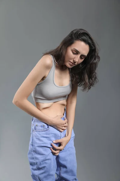 Young Woman Anorexia Grey Background — Stock Photo, Image