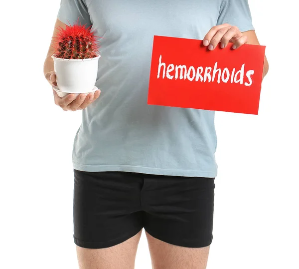 Young Man Holding Cactus Paper Text Hemorrhoids White Background — Stock Photo, Image