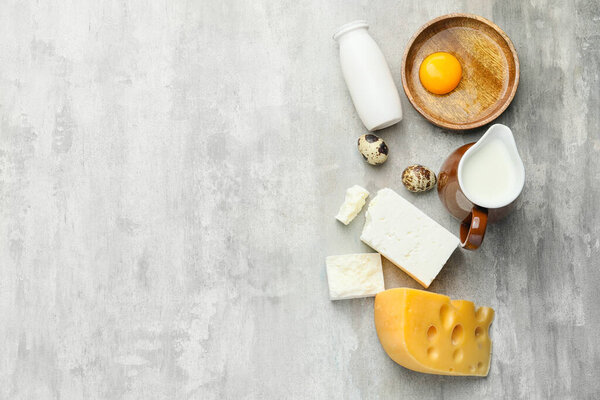 Different dairy products on grey background