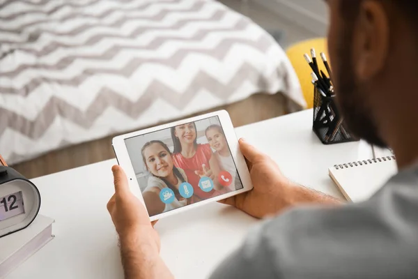 Young Man Video Chatting His Family Home — Stock Photo, Image