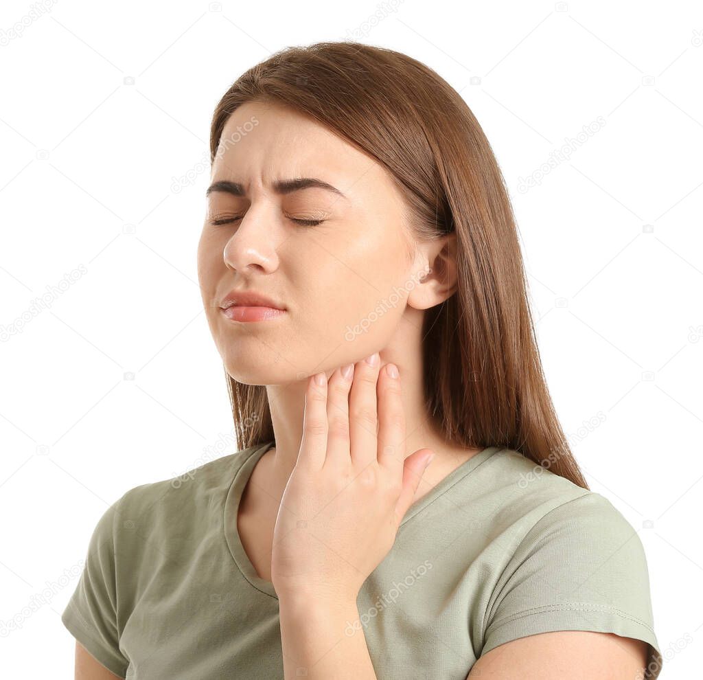 Young woman checking thyroid gland on white background