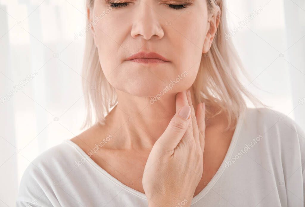 Woman with thyroid gland problem at home