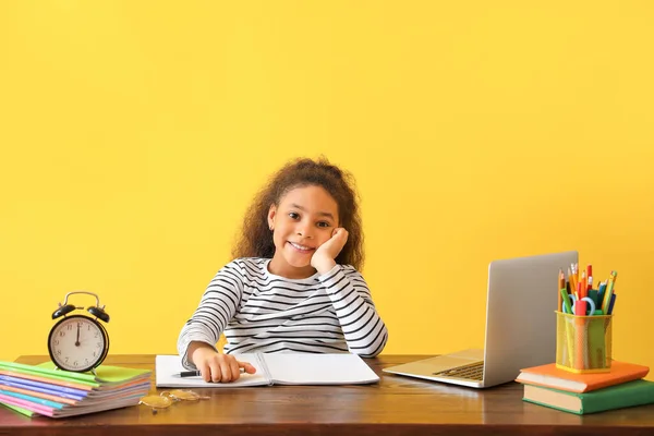 Little African American Girl Doing Homework Color Background — Stock Photo, Image