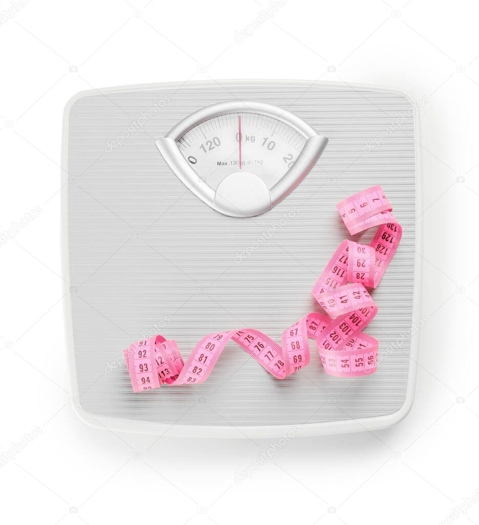 Weight scales with measuring tape on white background. Slimming concept