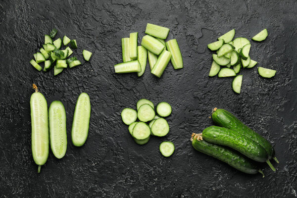 Green cucumber on dark background