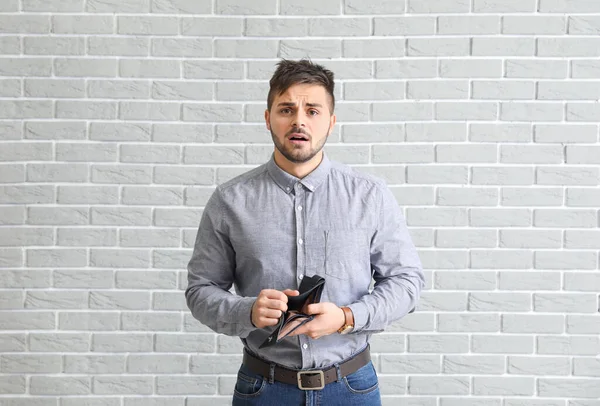 Sad Man Empty Purse Brick Background — Stock Photo, Image