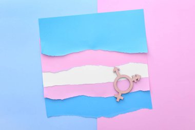 Flag made of paper and symbol of transgender on color background clipart