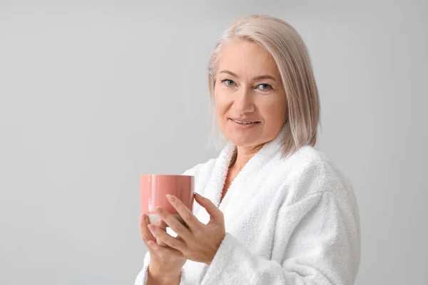 Mature Woman Bathrobe Cup Tea Grey Background — Stock Photo, Image