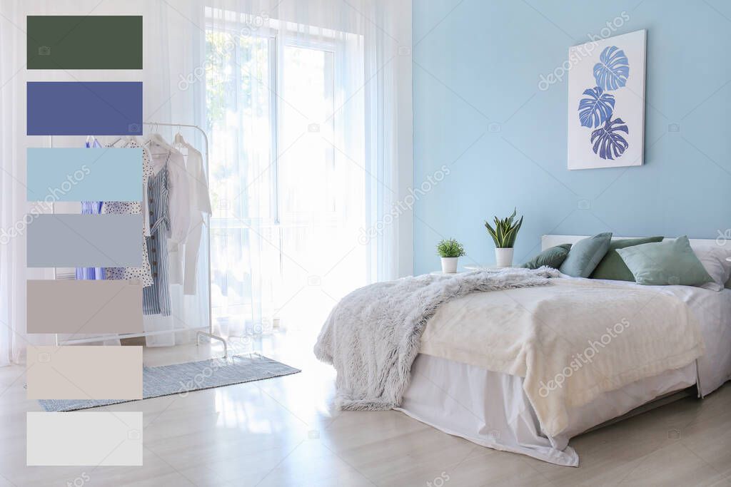 Interior of modern bedroom with big window and clothes rack. Different color patterns