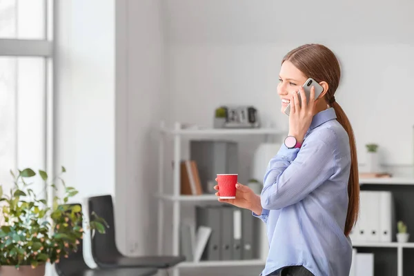 Young Woman Drinking Coffee While Talking Phone Office — Stock Photo, Image