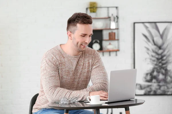 Young Man Drinking Coffee While Working Laptop Cafe — Stock Photo, Image