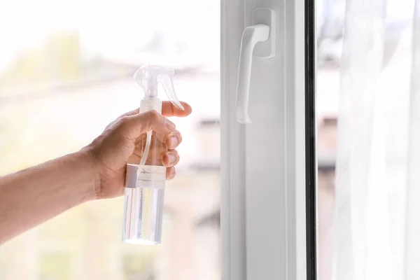 Man using sanitizer at home