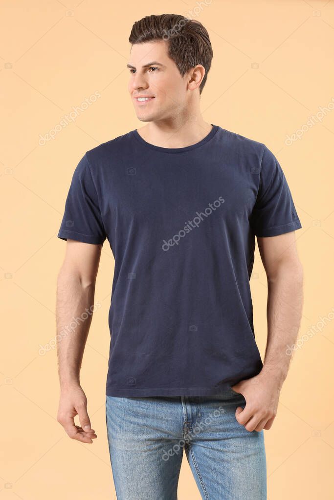 Man in stylish t-shirt on color background