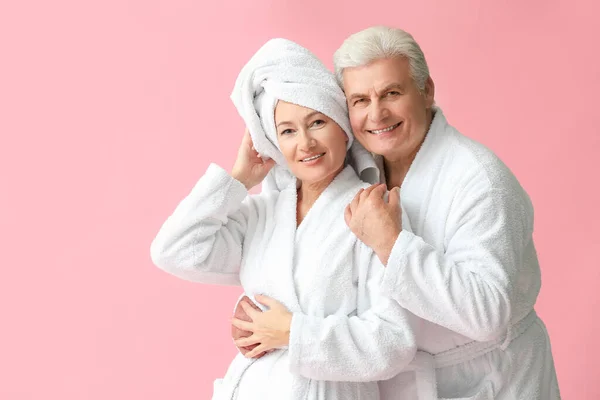 Mature Couple Bathrobes Color Background — Stock Photo, Image