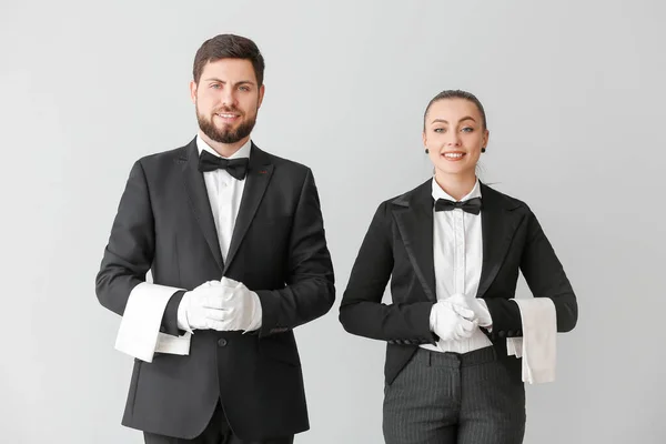 Male Female Waiters Grey Background — Stock Photo, Image