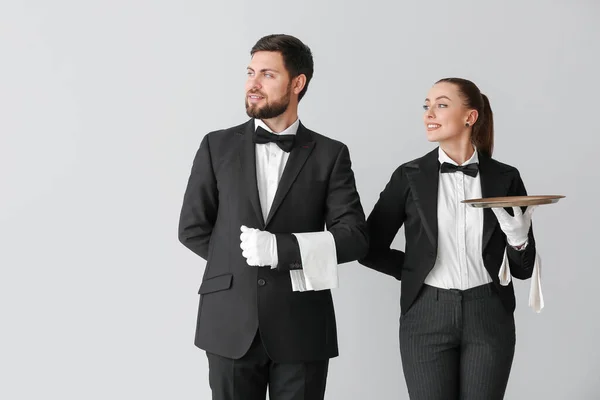 Male Female Waiters Grey Background — Stock Photo, Image